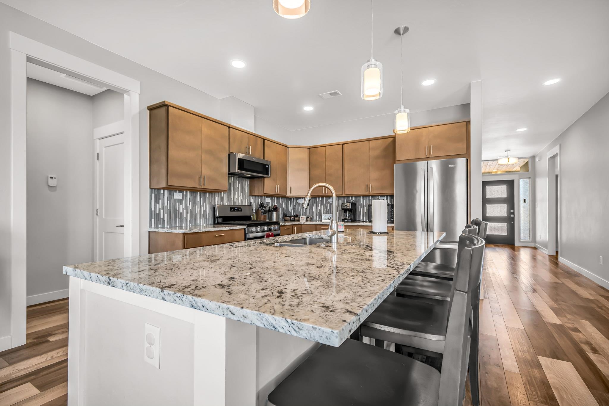 506 Grama Court Grand Junction, CO 81504 - Photo 9 of 28 a kitchen with stainless steel appliances granite countertop a sink refrigerator and cabinets