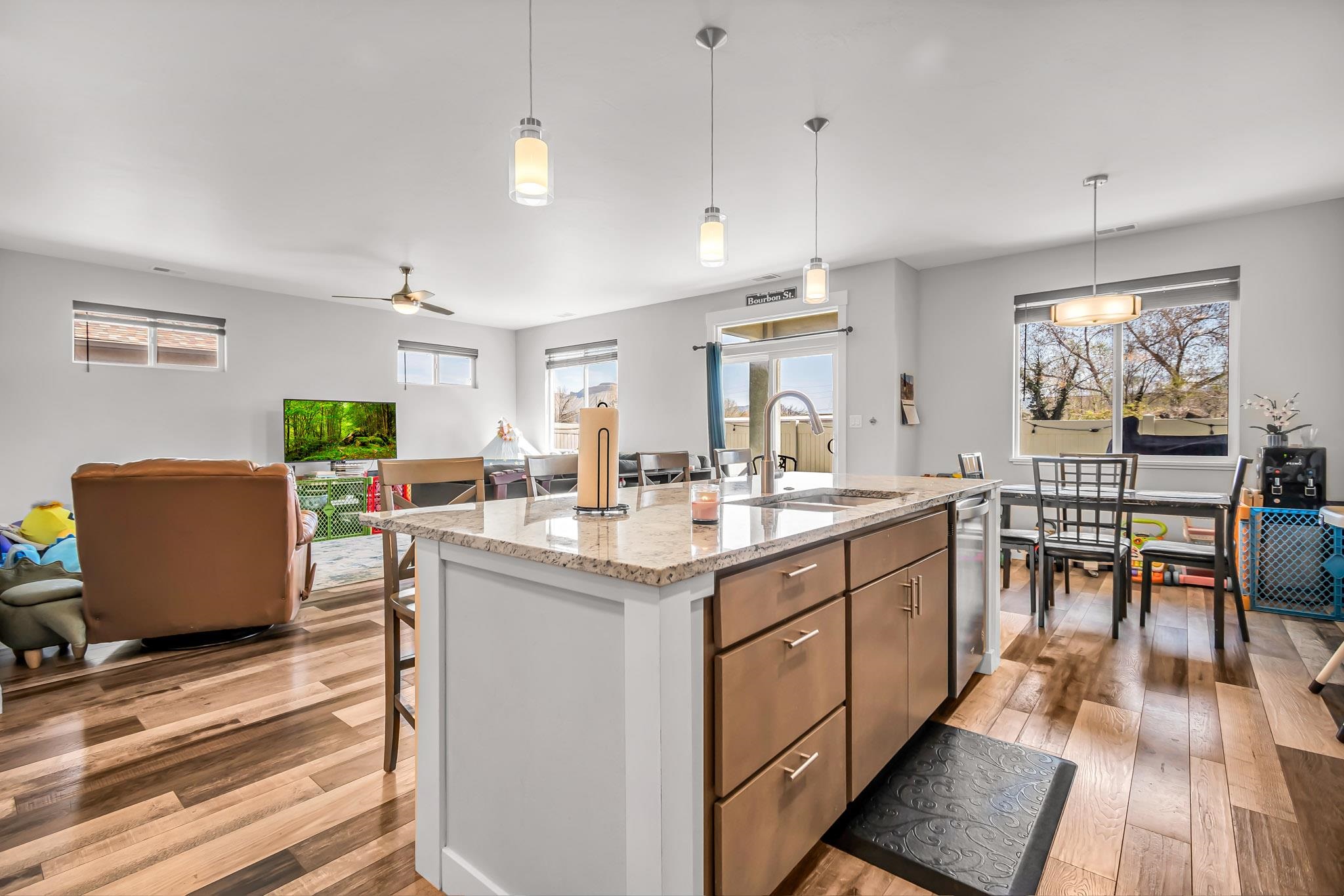 506 Grama Court Grand Junction, CO 81504 - Photo 10 of 28 a kitchen with stainless steel appliances granite countertop a table chairs and a refrigerator
