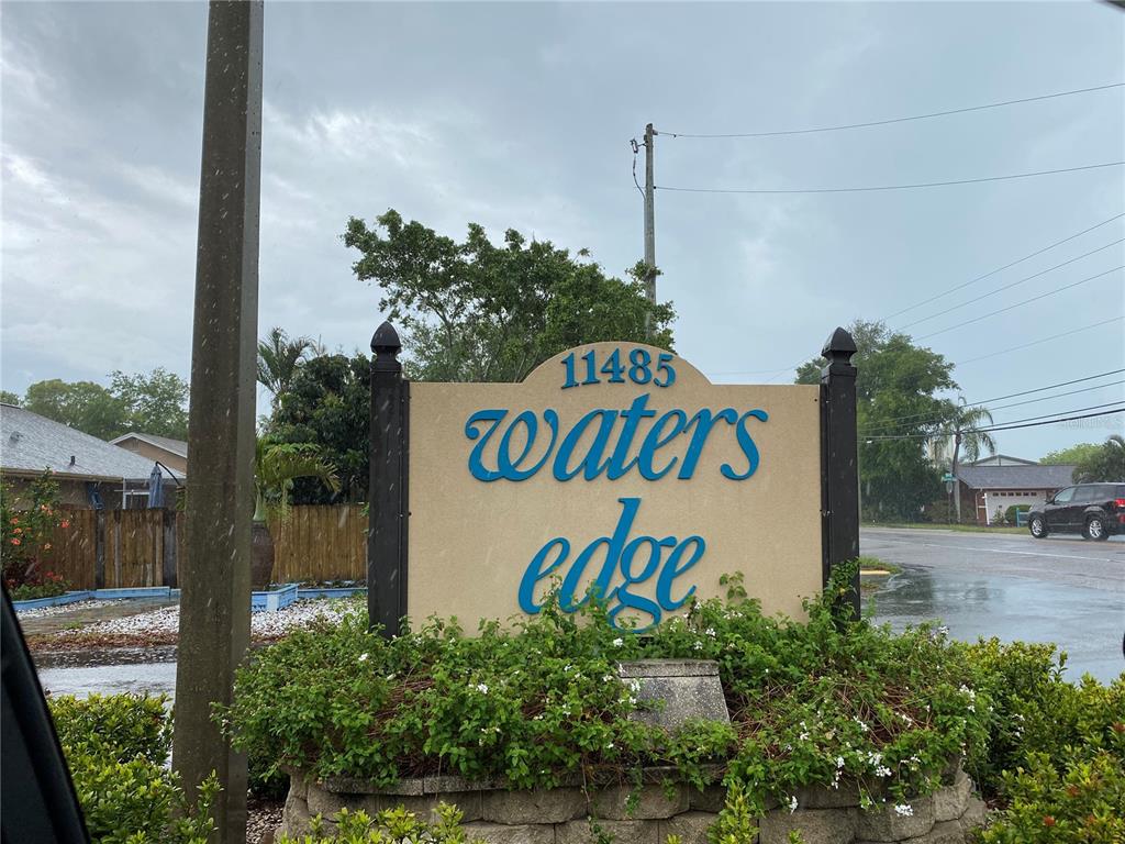 11485 Oakhurst Road, Unit 200303 Largo, FL 33774 - Photo 1 of 1 a sign that is on the side of a road