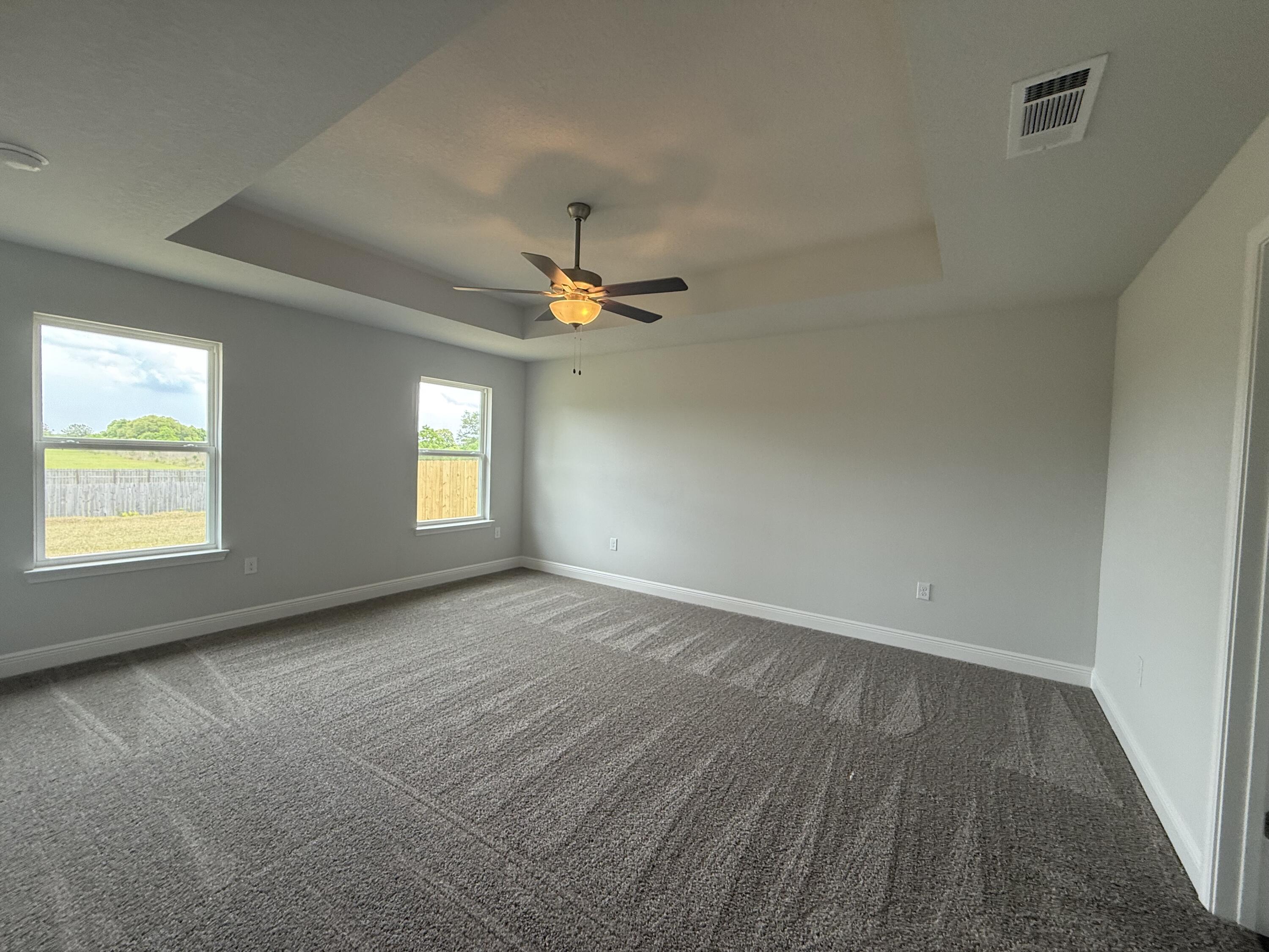 6004 Crocket Cove Crestview, FL 32539 - Photo 20 of 24 an empty room with windows