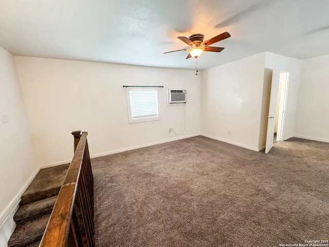 a view of a livingroom with a ceiling fan