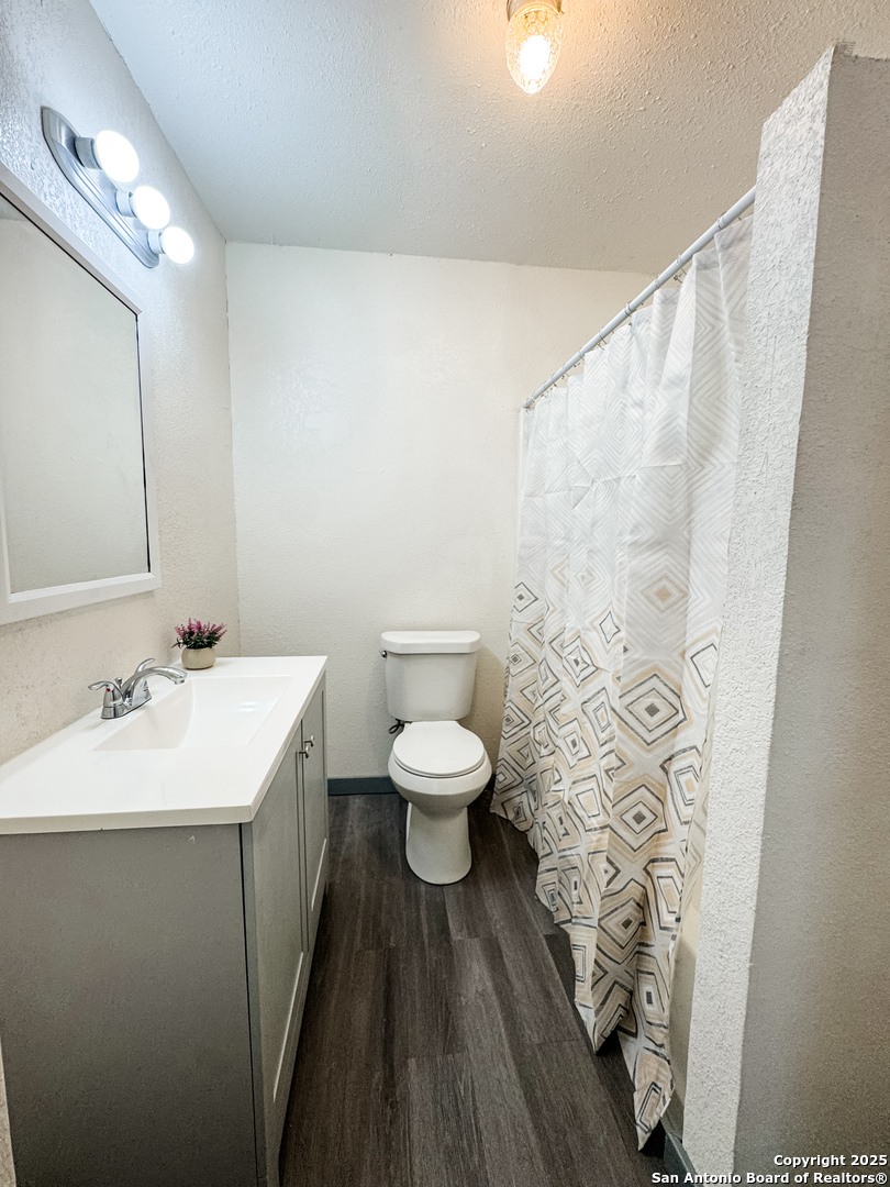 205 Plaza Navarra Road Brackettville, TX 78832 - Photo 19 of 21 a bathroom with a toilet a sink and a mirror