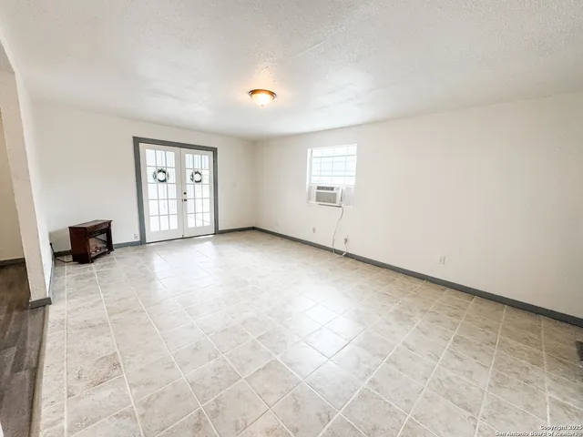 an empty room with windows