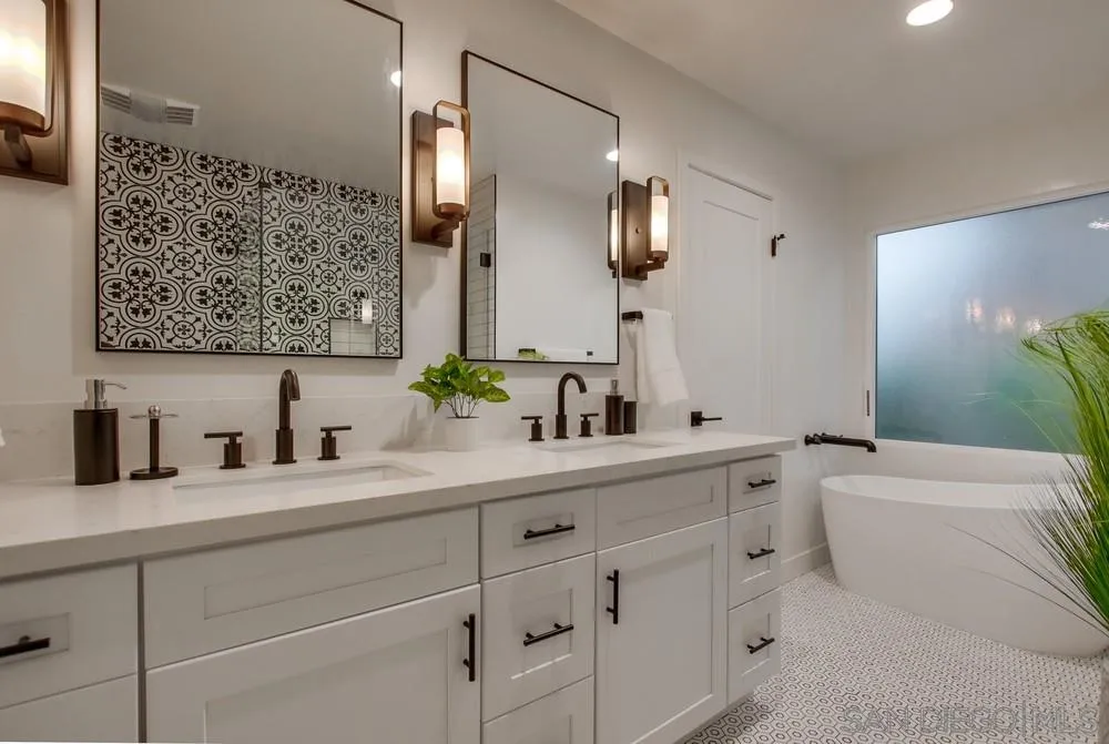 809 Colima Street La Jolla, CA 92037 - Photo 11 of 25 a bathroom with a sink and a mirror