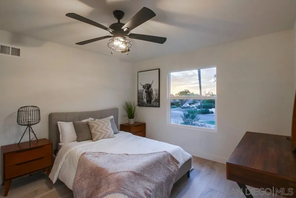 809 Colima Street La Jolla, CA 92037 - Photo 12 of 25 a bedroom with a bed and a window