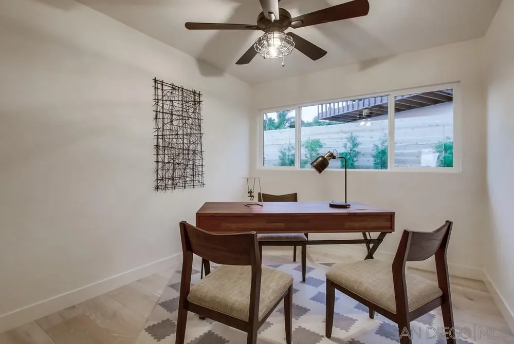 809 Colima Street La Jolla, CA 92037 - Photo 15 of 25 a view of a dining room with furniture window and wooden floor