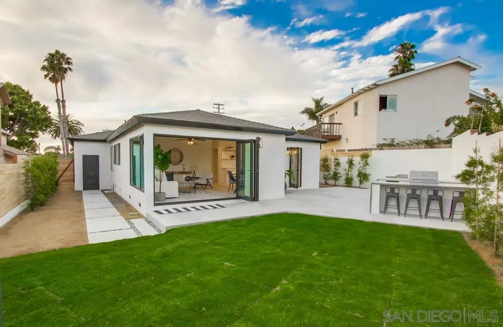 809 Colima Street La Jolla, CA 92037 - Photo 17 of 25 a view of a house with a yard and a patio