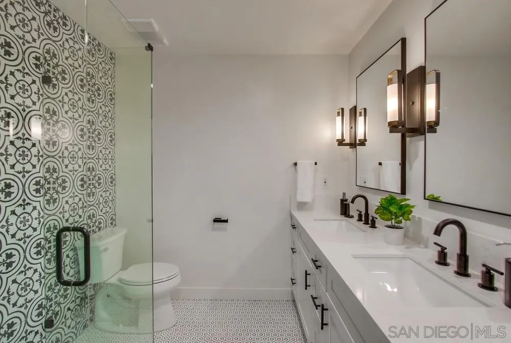 809 Colima Street La Jolla, CA 92037 - Photo 10 of 25 a bathroom with a toilet sink and shower
