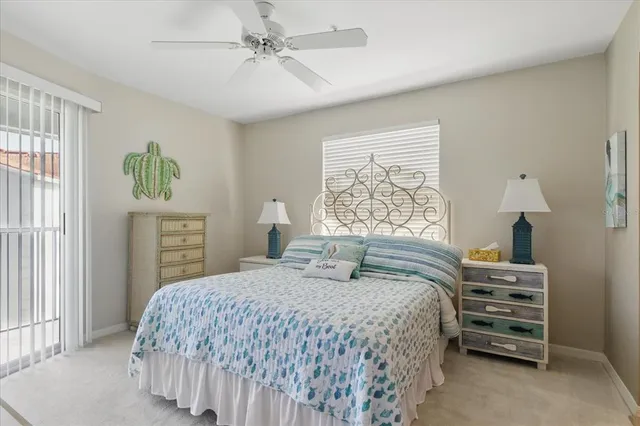 a bedroom with a bed a dresser and a window