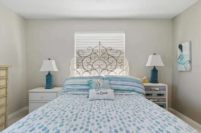 a bathroom with a sink a toilet and a window