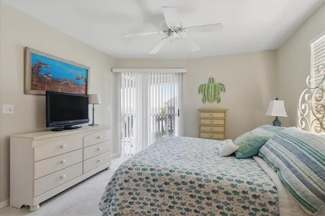 a bedroom with a bed and a flat screen television
