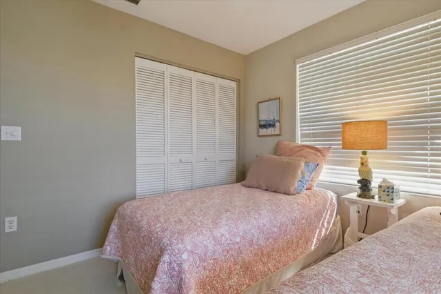 a bedroom with a bed and lamp