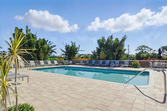 a view of a swimming pool with a yard