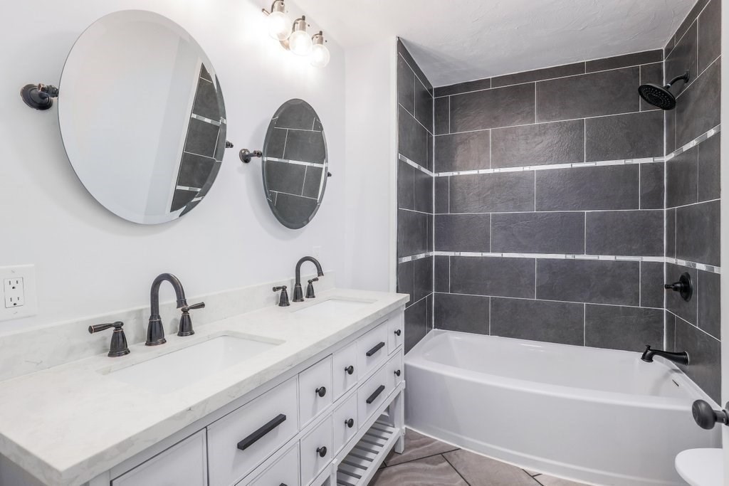 370 Thompson Road Webster, MA 01570 - Photo 38 of 42 a bathroom with a sink and a mirror