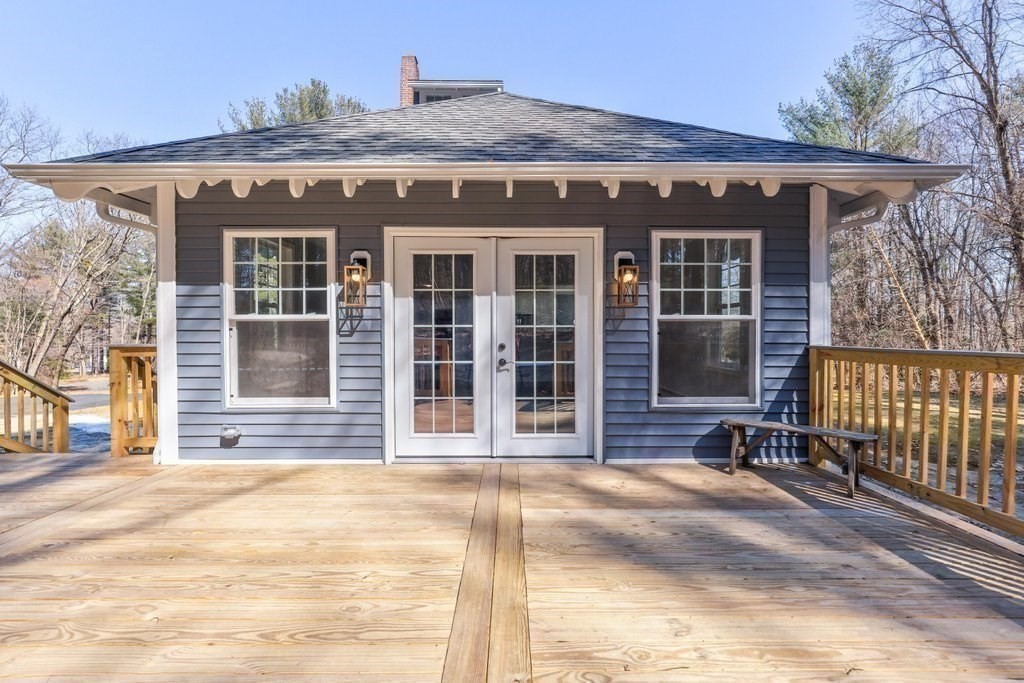 370 Thompson Road Webster, MA 01570 - Photo 10 of 42 a front view of a house with a garden