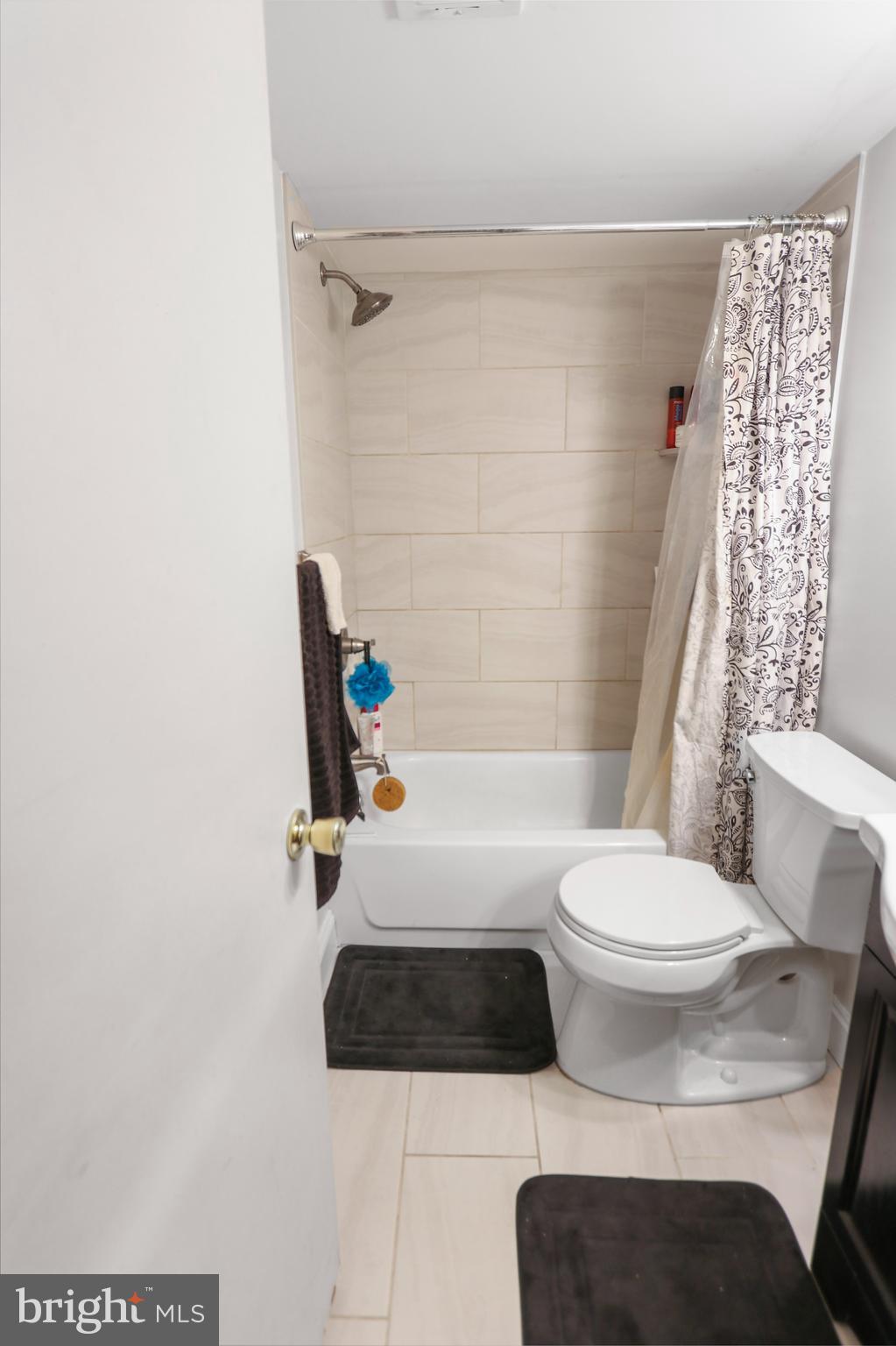 1001 White Oak Road Dover, DE 19901 - Photo 3 of 8 a white toilet sitting next to a bath tub