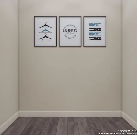 a view of a small space with wooden floor