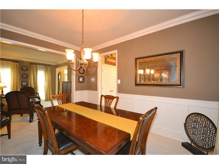 213 Barnhill Road Perkasie, PA 18944 - Photo 11 of 25 a view of a dining room with furniture and chandelier