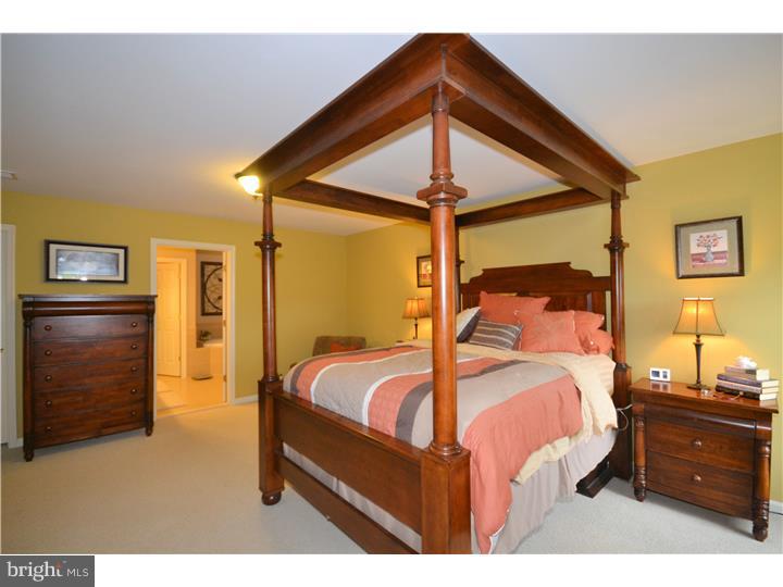 213 Barnhill Road Perkasie, PA 18944 - Photo 17 of 25 a bedroom with a bed and a walk in closet
