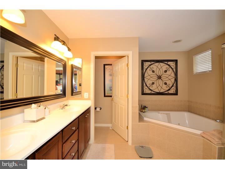 213 Barnhill Road Perkasie, PA 18944 - Photo 19 of 25 a bathroom with a tub sink and mirror