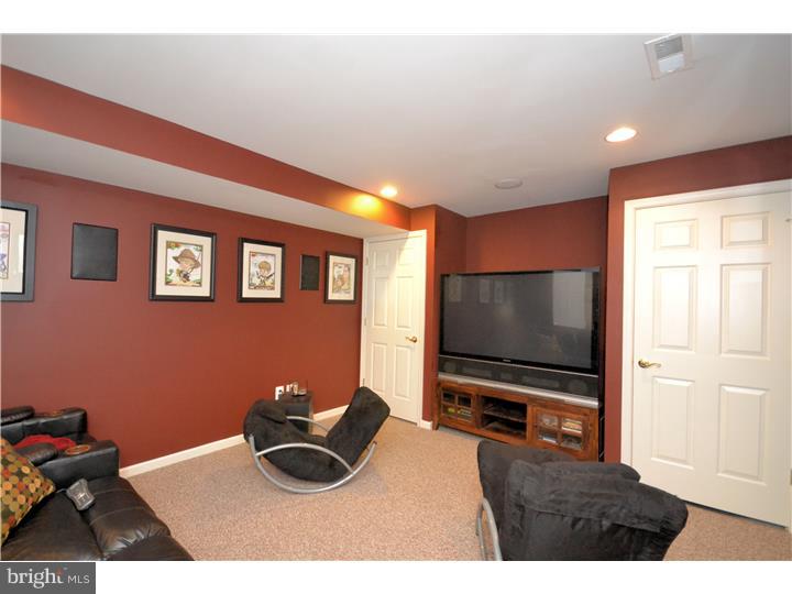 213 Barnhill Road Perkasie, PA 18944 - Photo 21 of 25 a living room with furniture and a flat screen tv