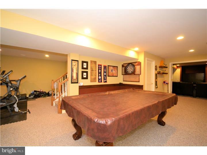 213 Barnhill Road Perkasie, PA 18944 - Photo 22 of 25 a living room with furniture and a flat screen tv