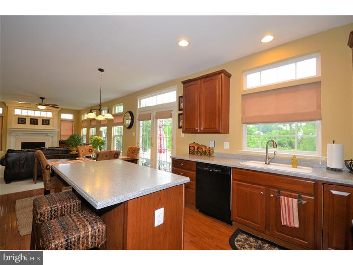 213 Barnhill Road Perkasie, PA 18944 - Photo 6 of 25 a kitchen with kitchen island a sink window and cabinets