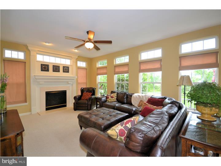 213 Barnhill Road Perkasie, PA 18944 - Photo 9 of 25 a living room with furniture fireplace and large windows