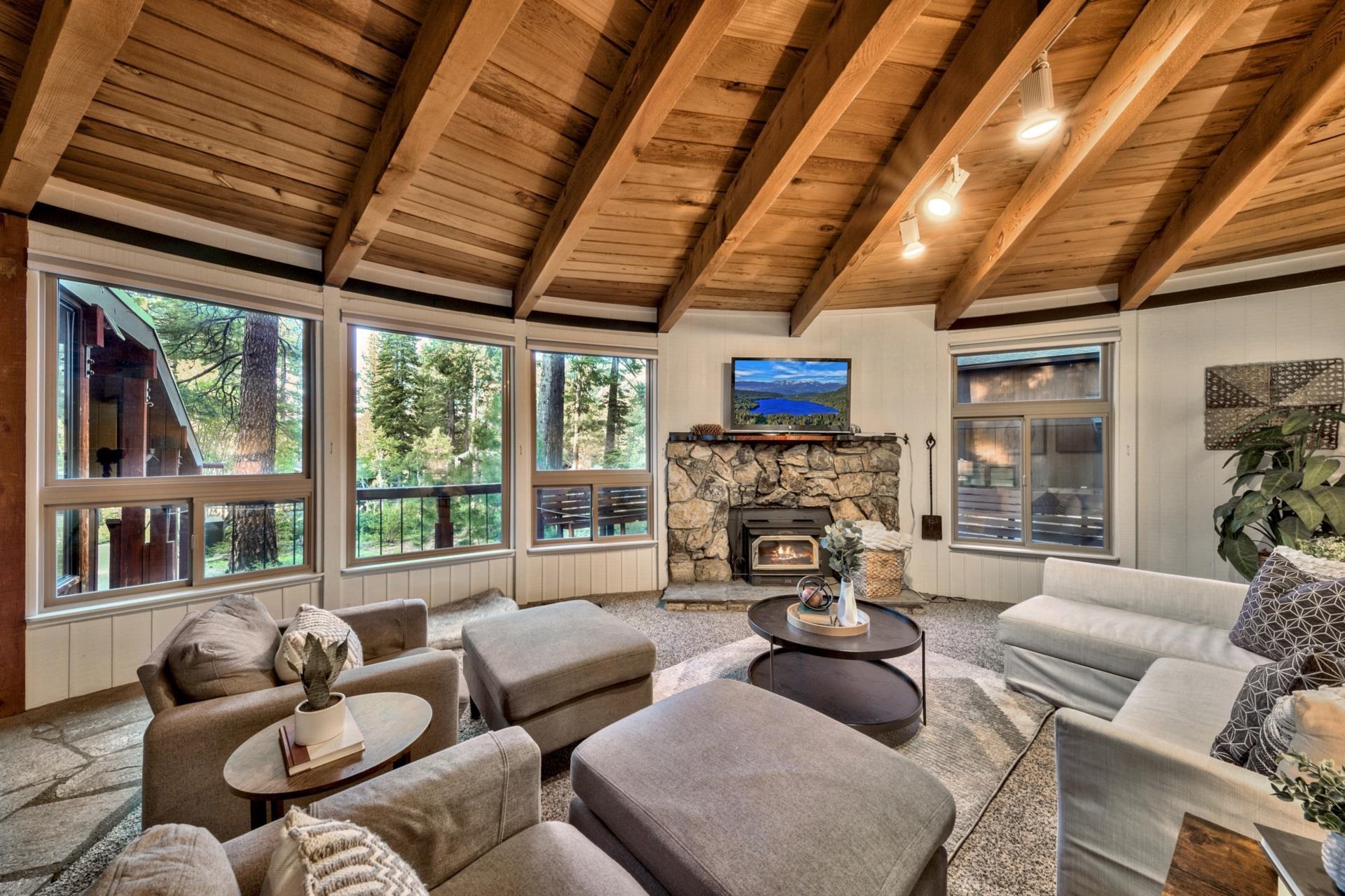 1625 Deer Path Truckee, CA 96161 - Photo 11 of 28 a living room with furniture floor to ceiling window and a flat screen tv