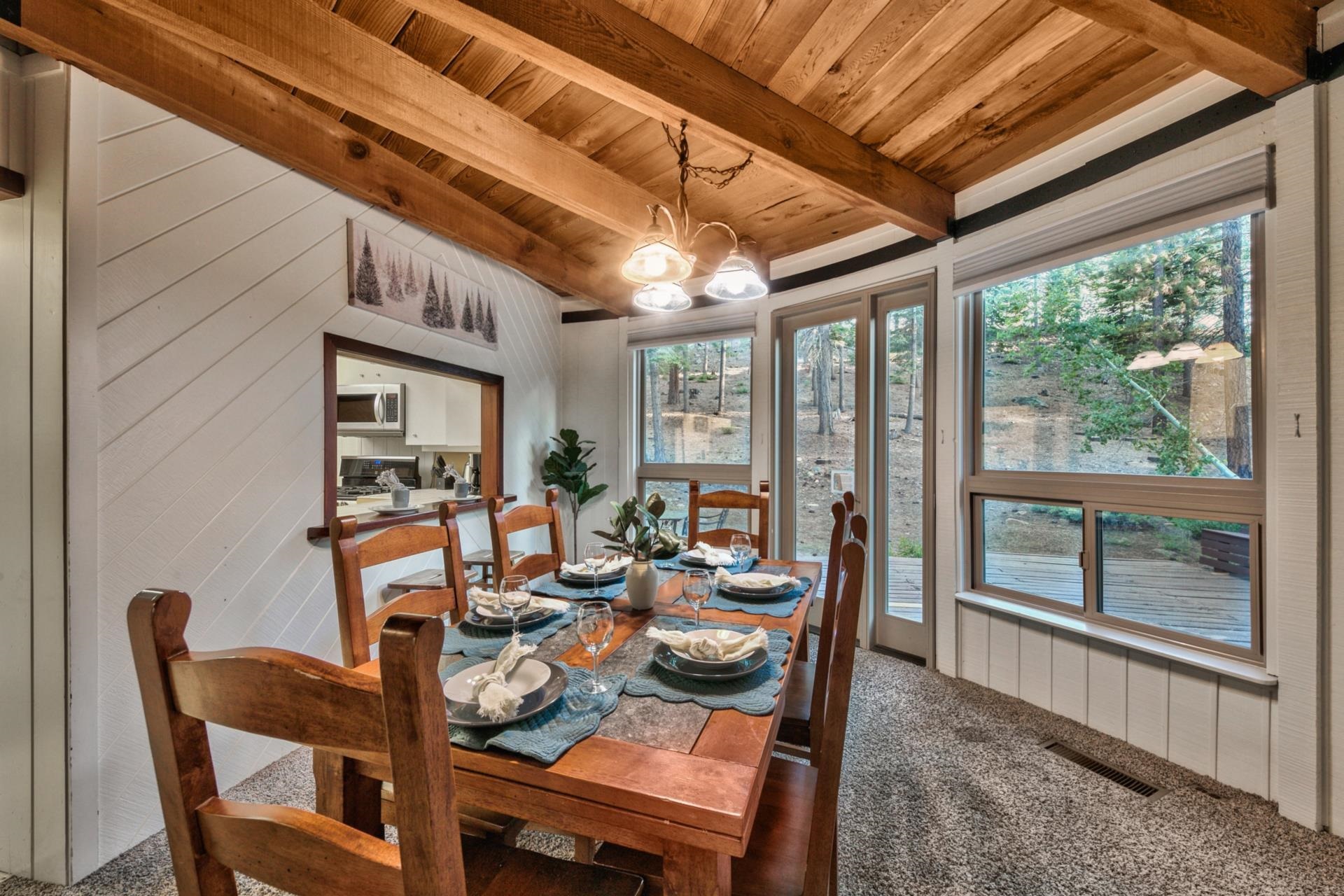 1625 Deer Path Truckee, CA 96161 - Photo 13 of 28 a dining room with furniture a rug and a large window