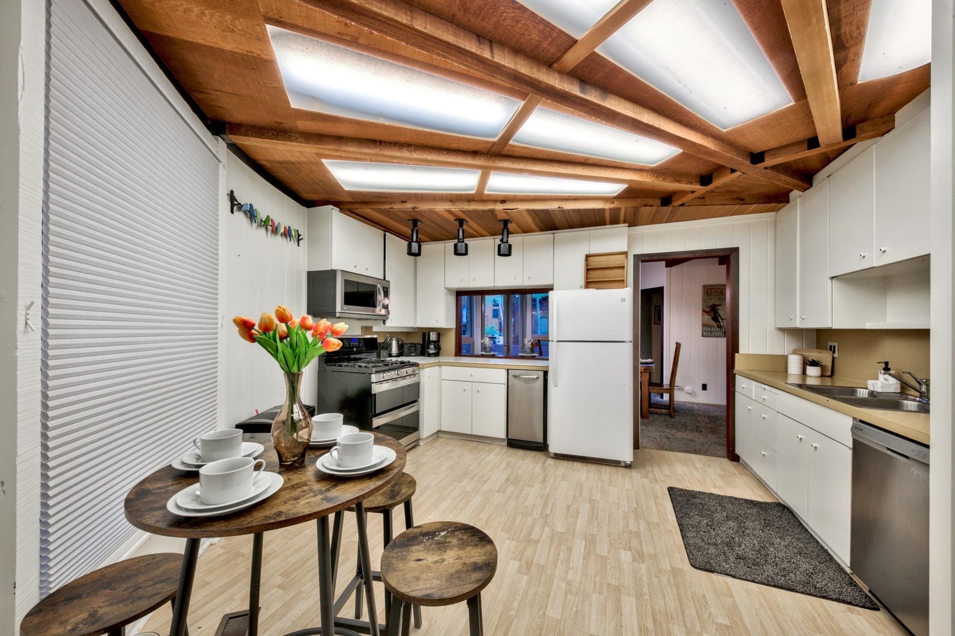 1625 Deer Path Truckee, CA 96161 - Photo 16 of 28 a kitchen with refrigerator and chairs