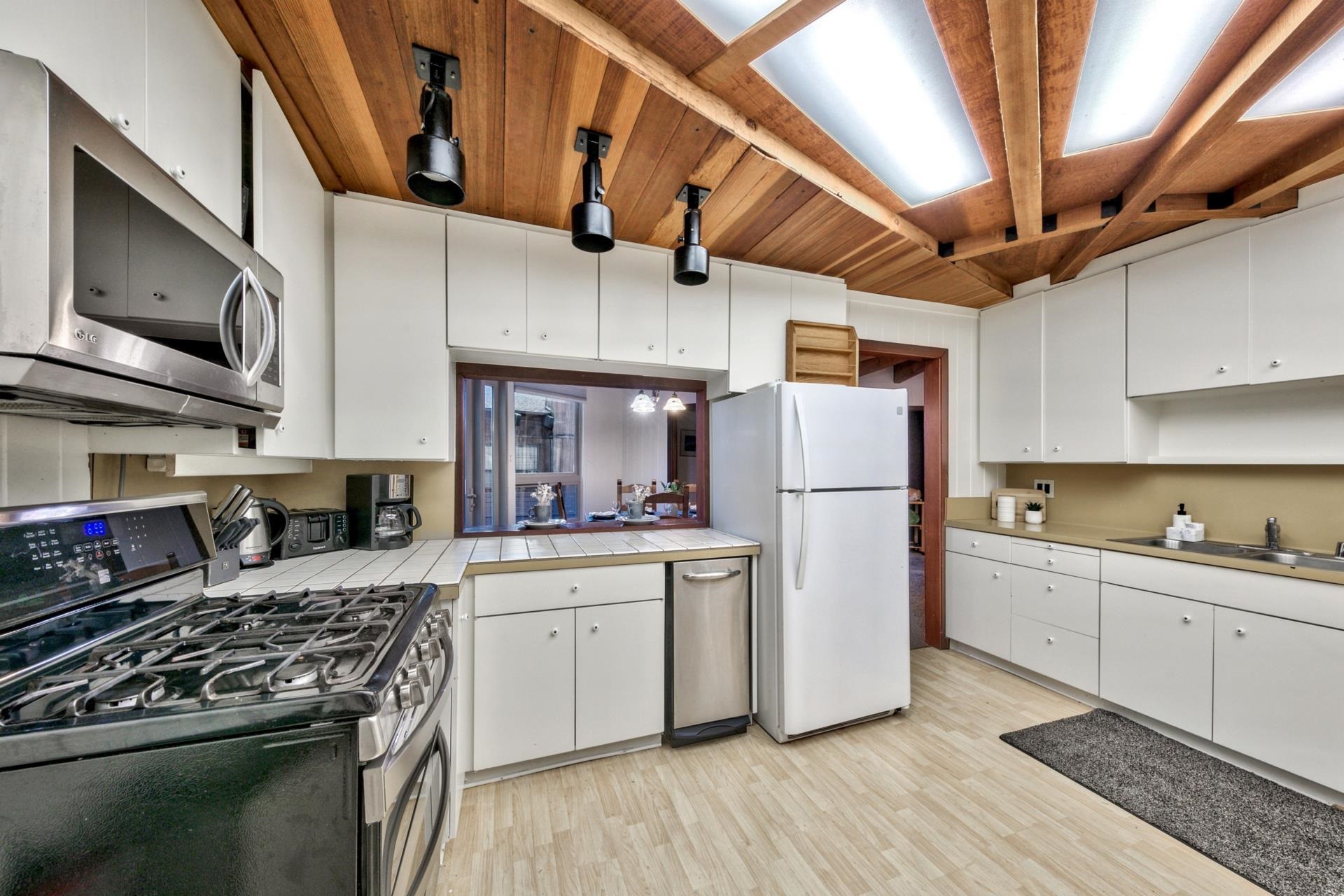 1625 Deer Path Truckee, CA 96161 - Photo 17 of 28 a kitchen with a sink stainless steel appliances and cabinets