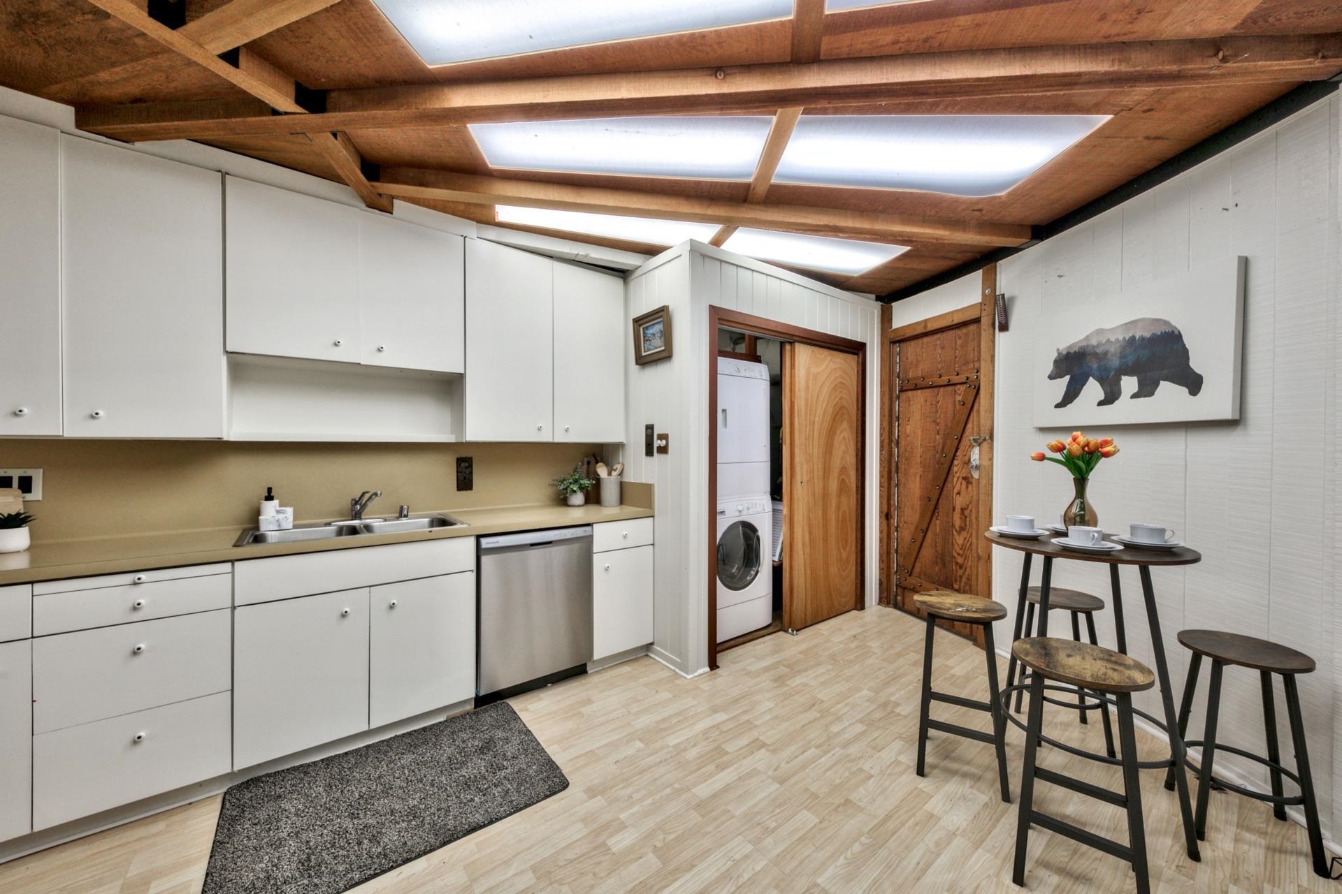 1625 Deer Path Truckee, CA 96161 - Photo 18 of 28 a kitchen with stainless steel appliances granite countertop a sink a stove a refrigerator and cabinets