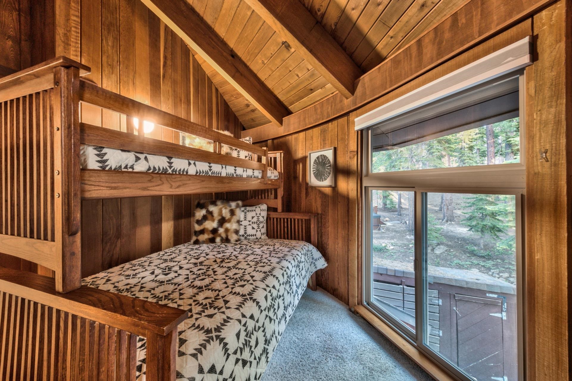 1625 Deer Path Truckee, CA 96161 - Photo 22 of 28 a bedroom with a bed and a large window with balcony view