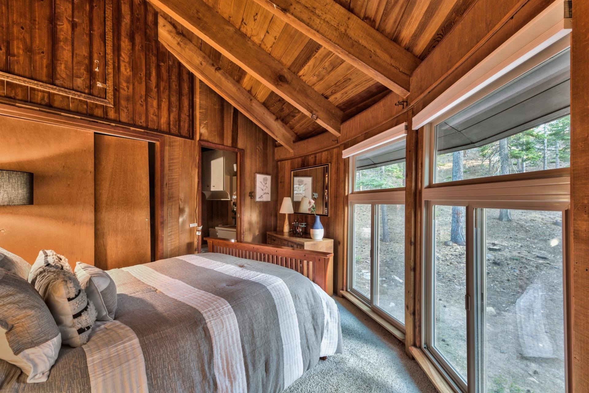 1625 Deer Path Truckee, CA 96161 - Photo 24 of 28 a bedroom with a bed and a large window