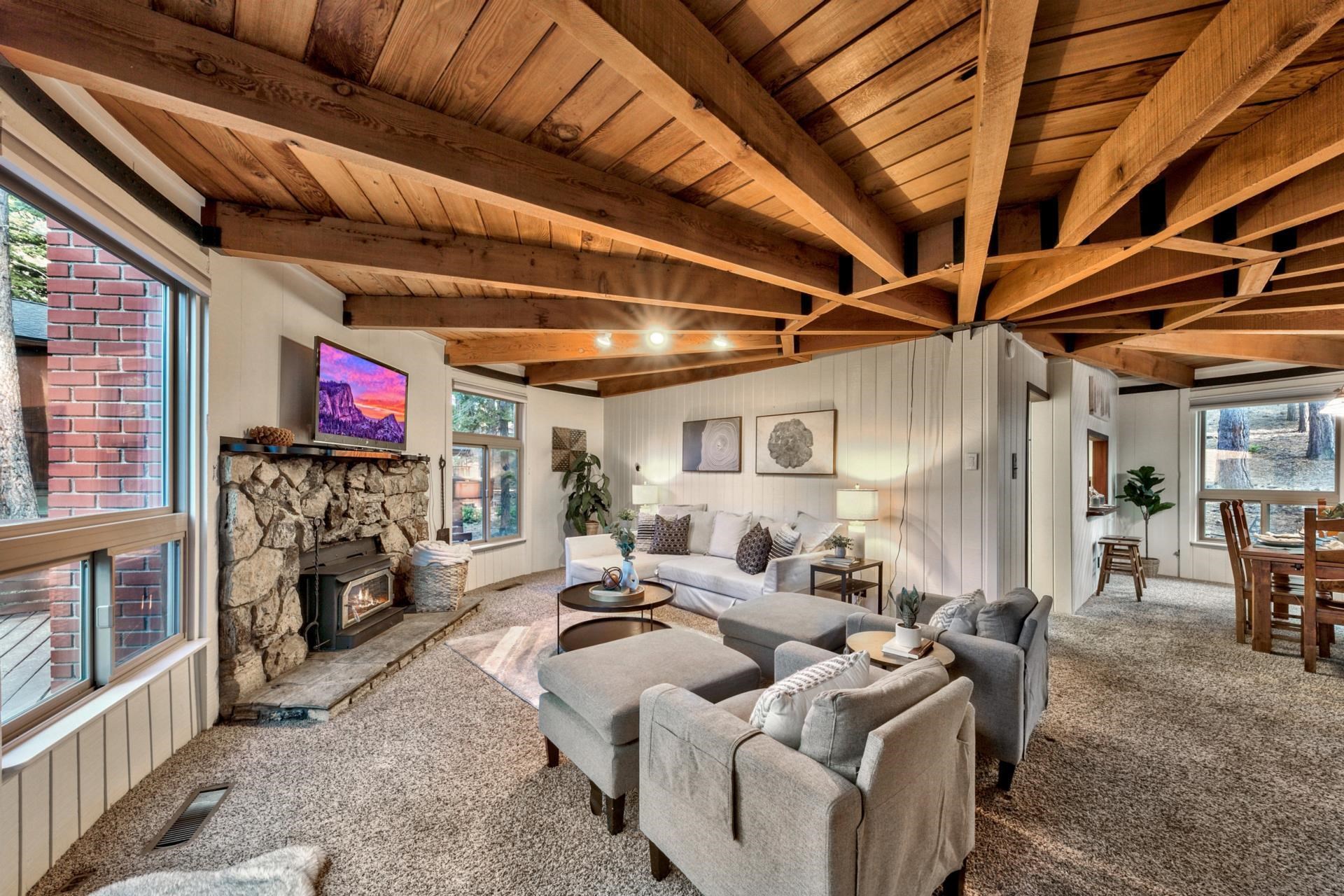 1625 Deer Path Truckee, CA 96161 - Photo 9 of 28 a living room with furniture a fireplace and a flat screen tv