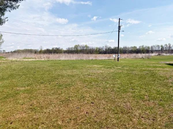 a view of an ocean and a yard