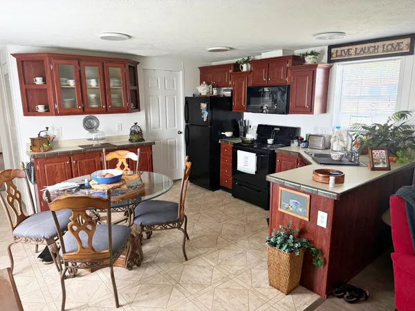 a view of a dining room with furniture and window