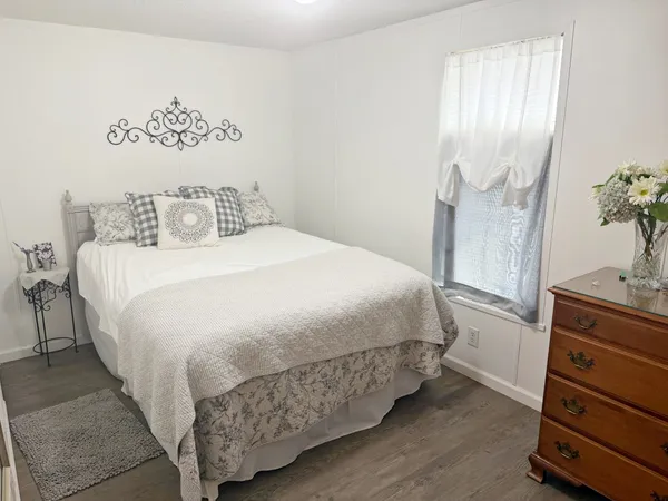 a bedroom with a bed and a dresser