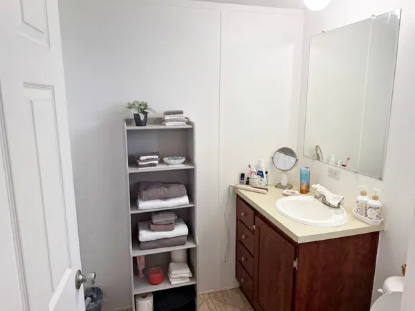 a bathroom with a sink and a mirror