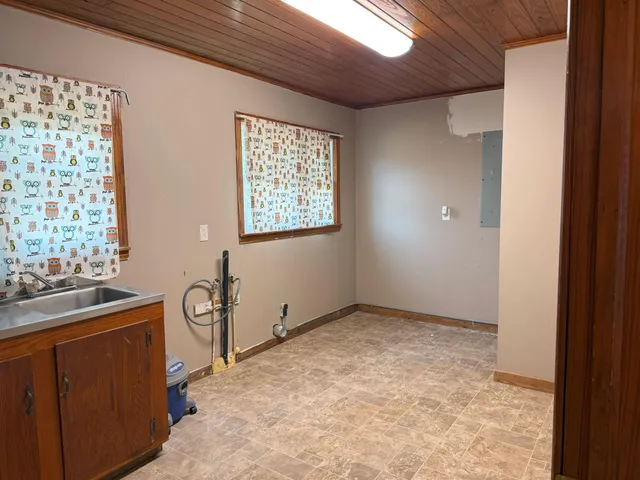 a view of livingroom with furniture and a window