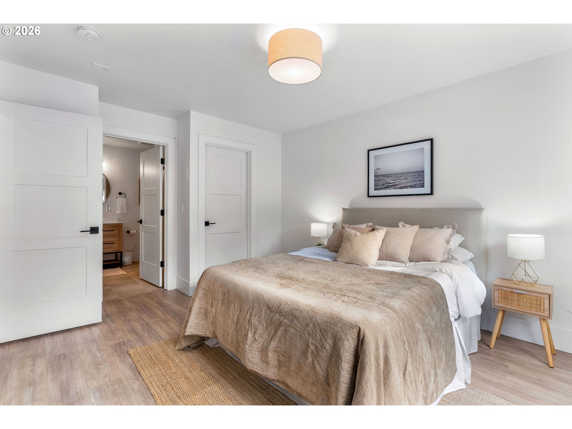 361 Frank Johns Road Stevenson, WA 98648 - Photo 8 of 27 a bedroom with a bed and a chandelier