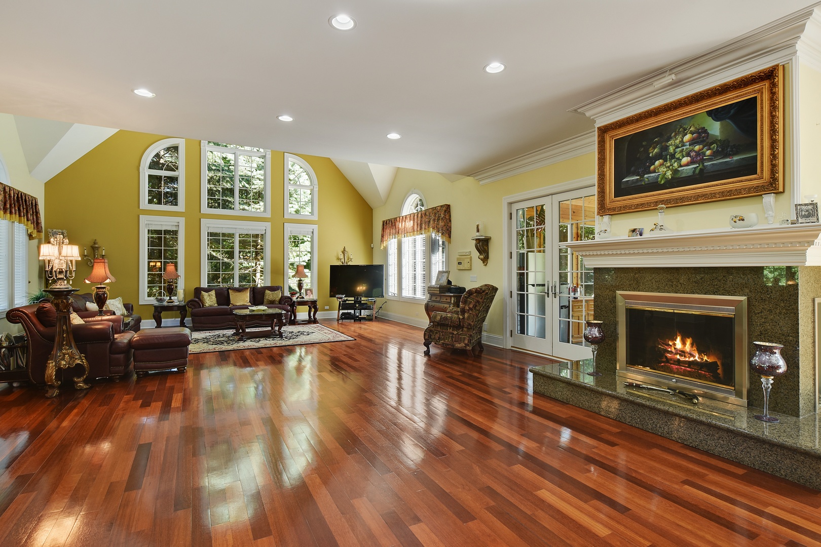 595 Plum Tree Road Barrington Hills, IL 60010 - Photo 12 of 46 a living room with furniture large window and a fireplace