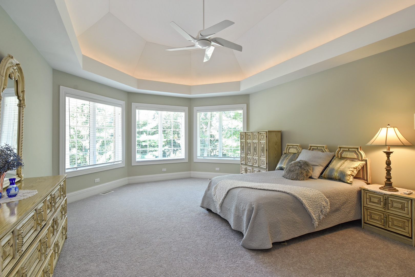 595 Plum Tree Road Barrington Hills, IL 60010 - Photo 21 of 46 a bedroom with a large bed and a large window