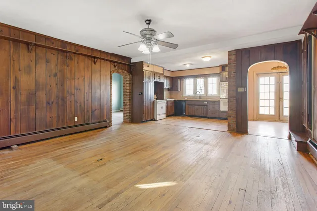 a view of livingroom with hardwood floor and a ceiling fan