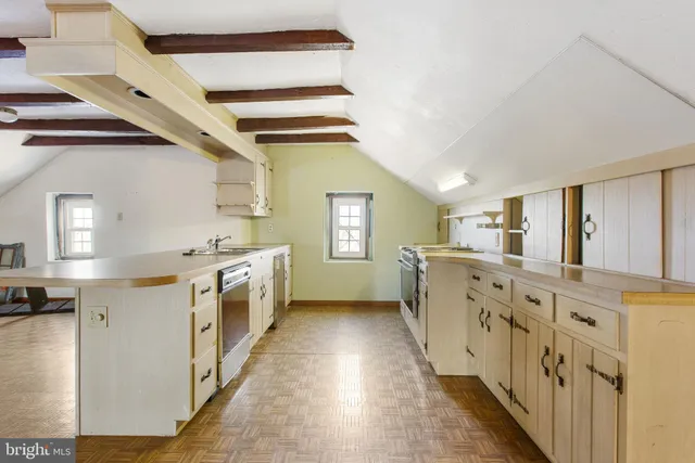 a kitchen with counter top space and sink