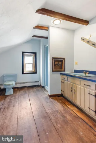 a view of a kitchen with electric appliances