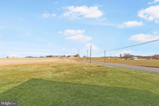 a picture of a bench in front of a window