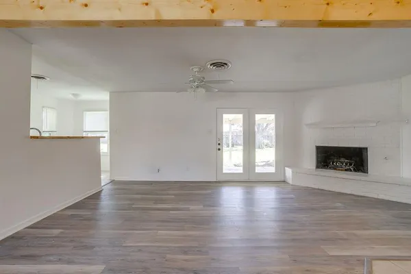 a kitchen with granite countertop a stove and a sink