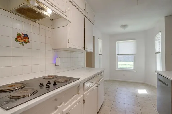 a kitchen with a sink and refrigerator